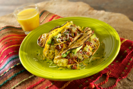 Corn tortillas packed with spicy chorizo and scrambled eggs topped with a tomatillo salsa, Mexican cheese, ripe avocado, and cilantro. These breakfast tacos are inexpensive, quick and so tasty.
