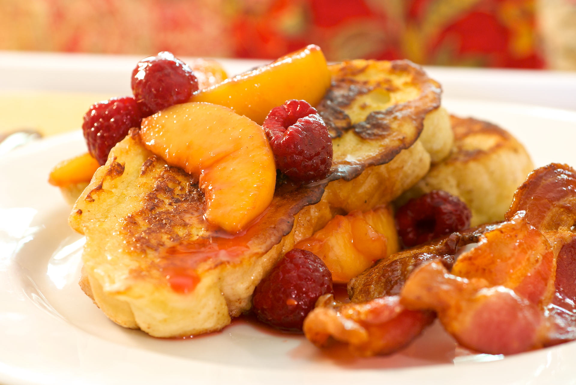 Peaches and raspberries are the perfect addition to the light sweetness to buttery French toast that’s great with a side of crispy bacon or sizzling sausage.
