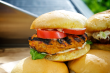 Grilled chicken burgers make a great choice at Super Bowl parties, for those times when you crave a burger, but you'd rather not have red meat. These chicken sliders are tasty and trendy!