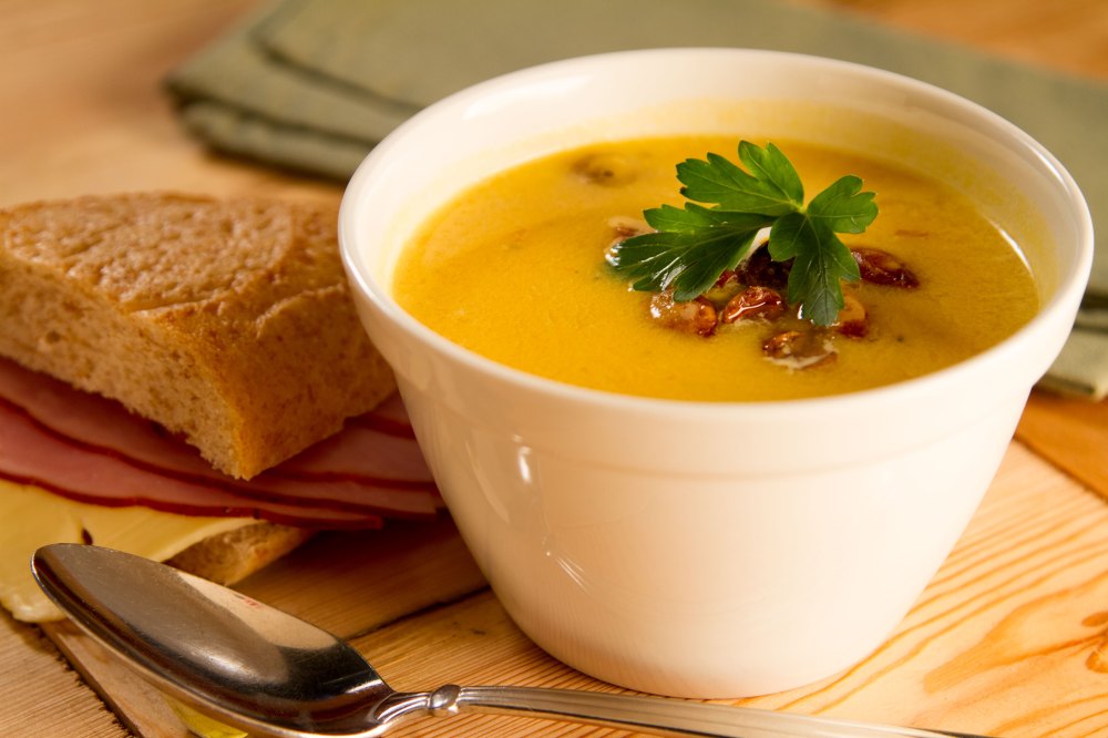 This rustic soup comes alive with the flavor of sweet caramelized roasted pumpkin or butternut squash. Its golden-yellow color and garnish of smoky-sweet crumbled bacon makes this a real eye-popper and show stopper.