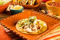 Perfect for a busy night, this fun recipe uses leftover grilled chicken seasoned with Mexican seasoning, topped with white queso sauce and stuffed in a crisp skillet-griddled corn tortilla taco. Taco Tuesdays are anything but boring and a fun way to celebrate with a school-related theme.