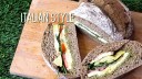 Picnic loaf sandwich made by hollowing out a loaf of bread and stuffing with a variety of fillings. 