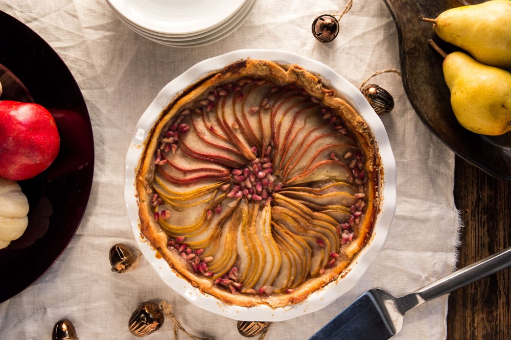 This pie combines sweet and tart flavors with fresh fruit to create a unique but familiar offering that celebrates traditional seasonal ingredients with trendy twists such as pomegranate arils. It also makes a beautiful centerpiece for the dessert table if it is made with multiple pear types.