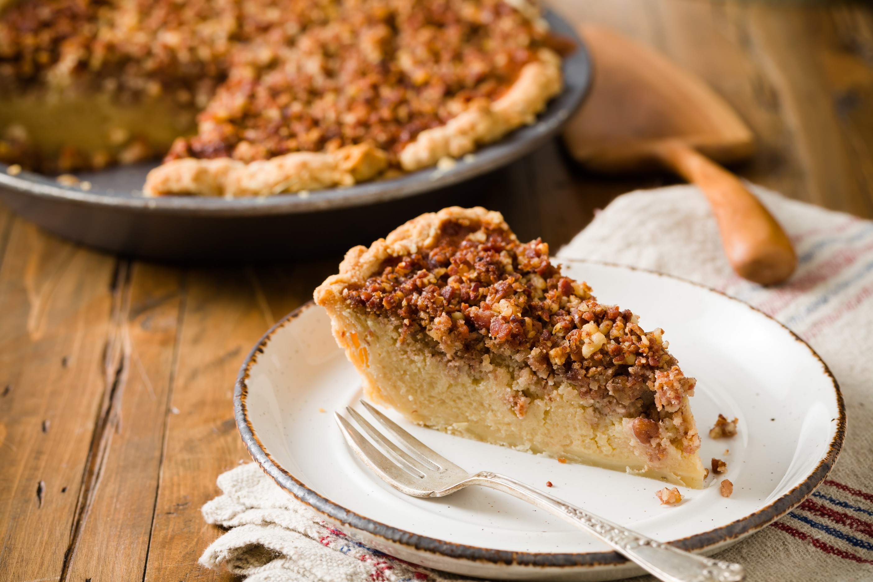 This delicious holiday recipe for Maple Bacon Idaho® Potato Pie brings some new twists to an an old classic. Filled with Idaho Potatoes, sugar, maple syrup and whipped cream, then topped with bacon and pecans.  Bacon and maple are some of the hottest flavors this season and they make the perfect combination for this Potato Pie. 