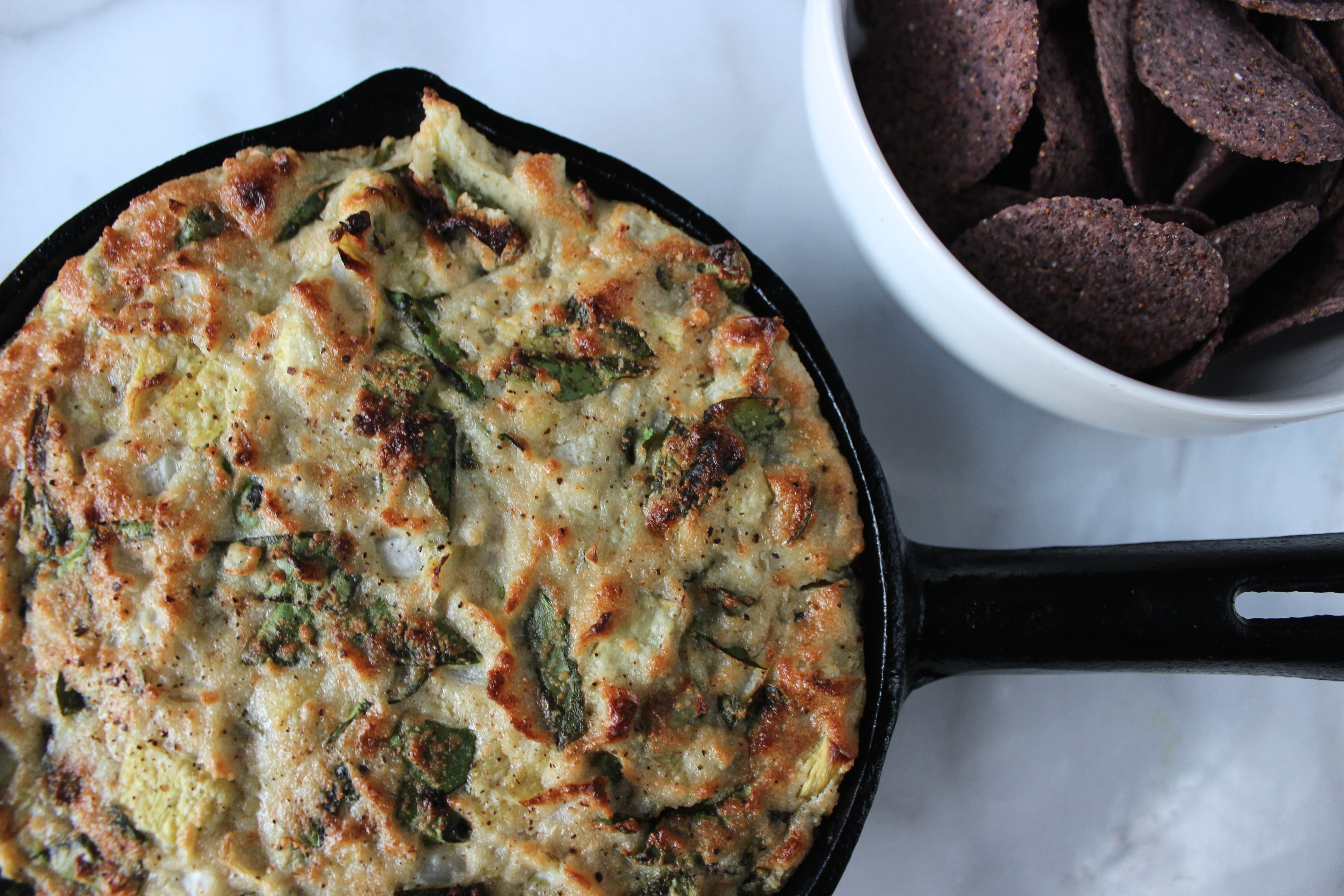 HEALTHY HOT SPINACH AND ARTICHOKE DIP courtesy of Ritual Wellness curated by Project Juice