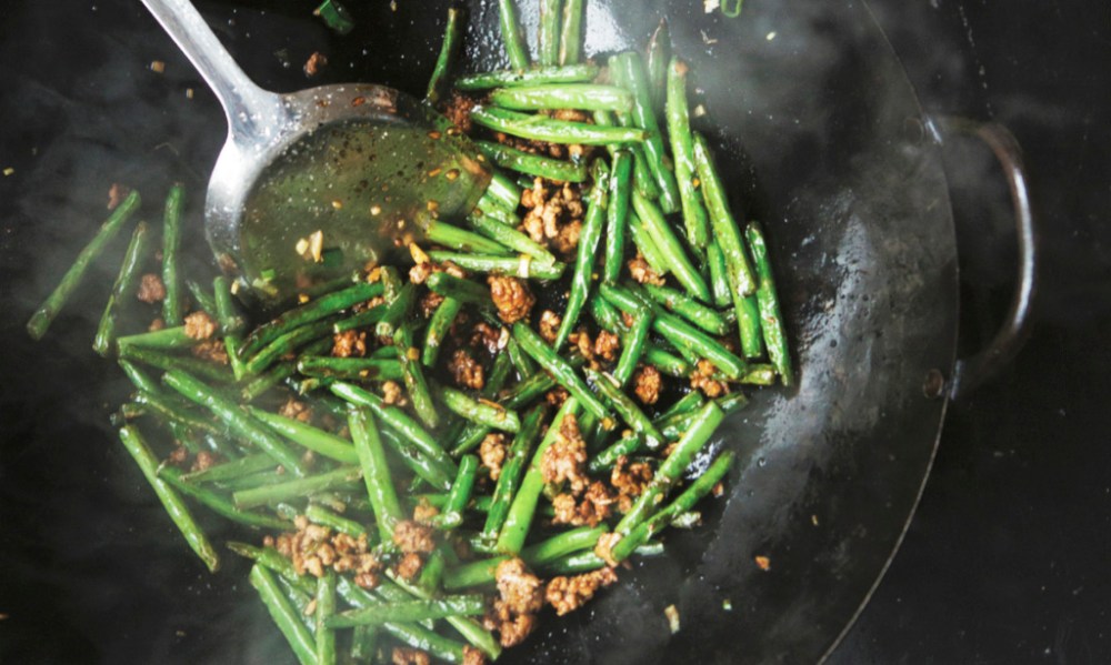 "A former coworker once scoffed at the idea that my dry-fried green beans could beat his broccoli salad at an office potluck party. Let’s just say that I left the office with an empty dish, and he didn’t. This recipe is Sichuanese in origin and involves blistering the green beans using a shallow frying method called gan bian, or "dry-frying".