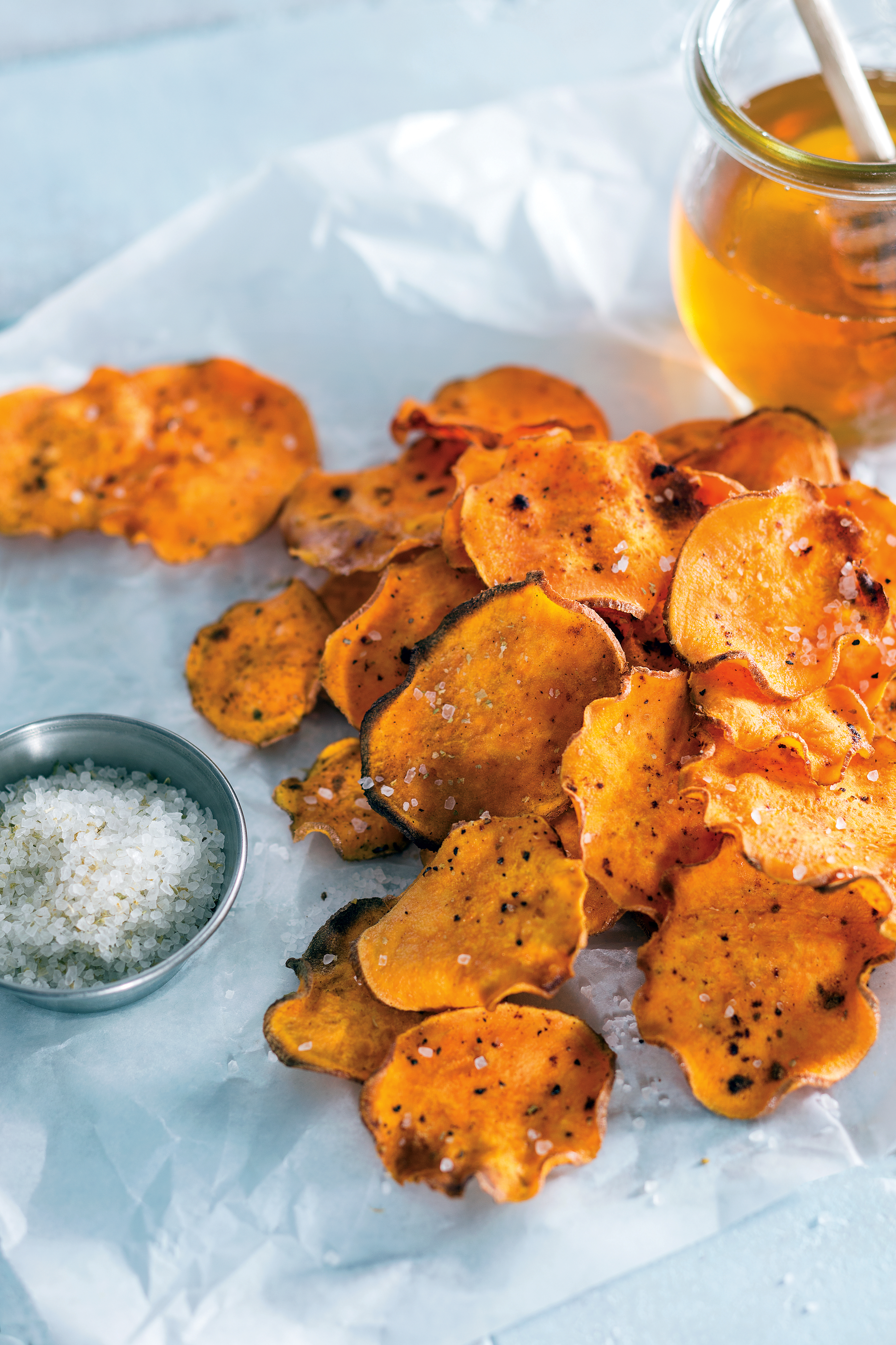 Ever think about making your own potato chips? It's easier than you think. These Honey-Glazed Sweet Potato Chips are made with - no surprise - sweet potatoes, enhanced with the flavors of honey and ground cinnamon.