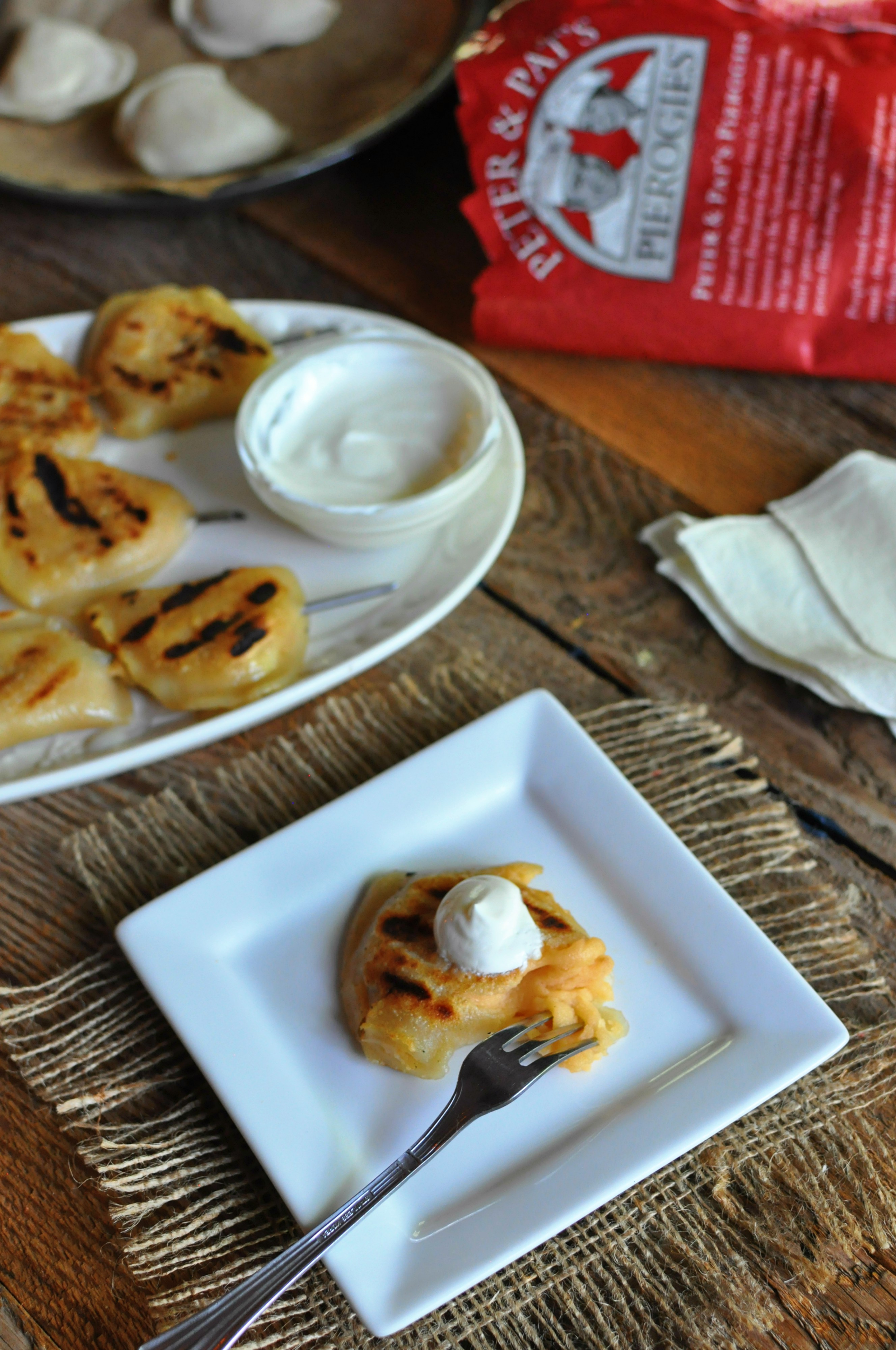 How to prepare a pre-made pierogi on the grill, served with sour cream and applesauce