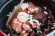 Feijoada is traditionally known as a stew with beef and pork, of Portuguese origin. Filled with a smoky, garlicky, flavor this Brazilian dish is a barbecued crowd-pleaser.