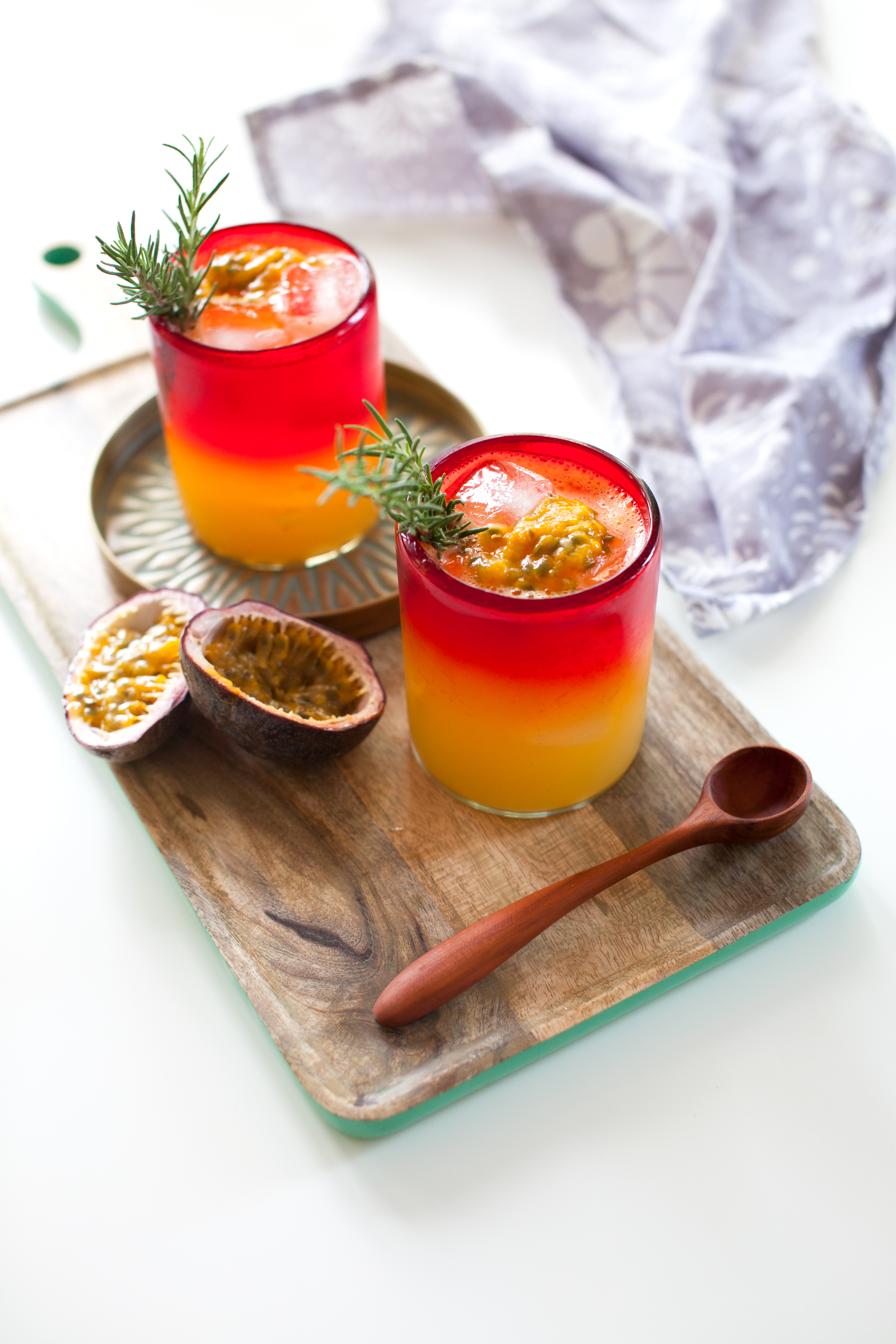 In an ice filled low ball glass add the vodka, passion fruit juice, Ginger Lime Sparkling Ice and stir. Garnish with a sprig of rosemary and a spoonful of passion fruit pulp and serve.