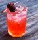Flor adora made with lemon juice, raspberry ginger syrup, gin and ginger ale. 