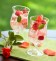 A French Rose Sangria made with rose wine, Grand Marnier, club soda and raspberries. 