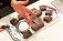 Powdered sugar is sprinkled over the a tray of fresh baked brownies, made with Rio Luna organic jalapeño peppers.
