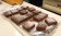 A tray full of brownie squares, made with Rio Luna Organic Peppers, topped with powdered sugar. 
