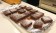 A tray full of brownie squares, made with Rio Luna Organic Peppers, topped with powdered sugar.