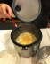 Adding Parmesan Cheese.