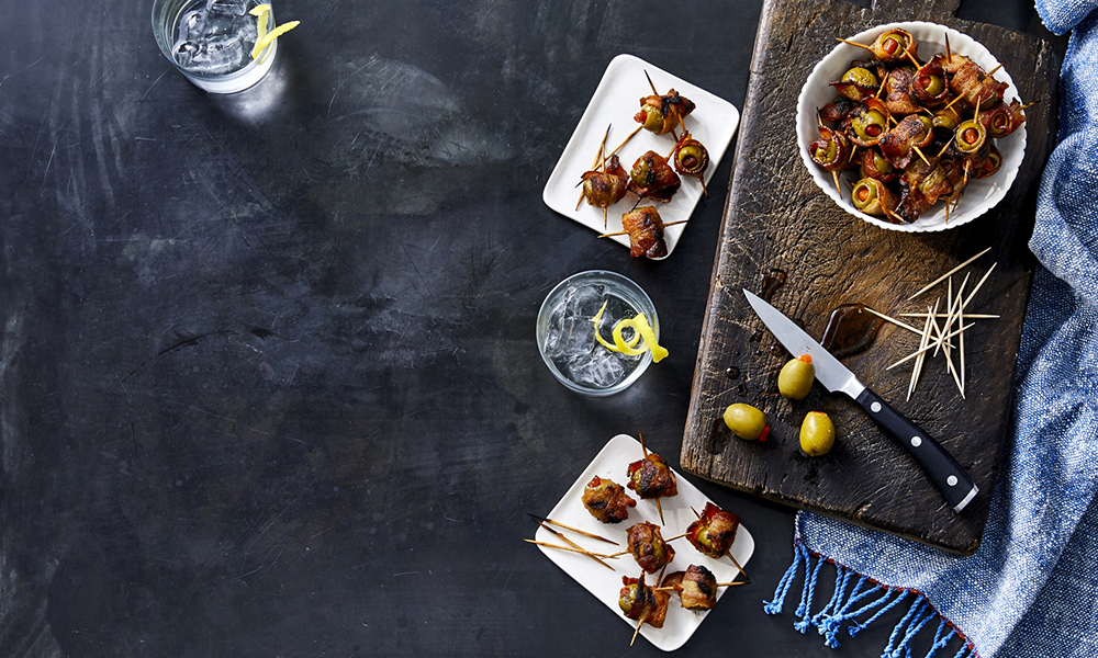These bacon-wrapped olives are simple to make and the perfect combination of classy meets country. From Martina McBride's new cookbook, My Kitchen Mix.