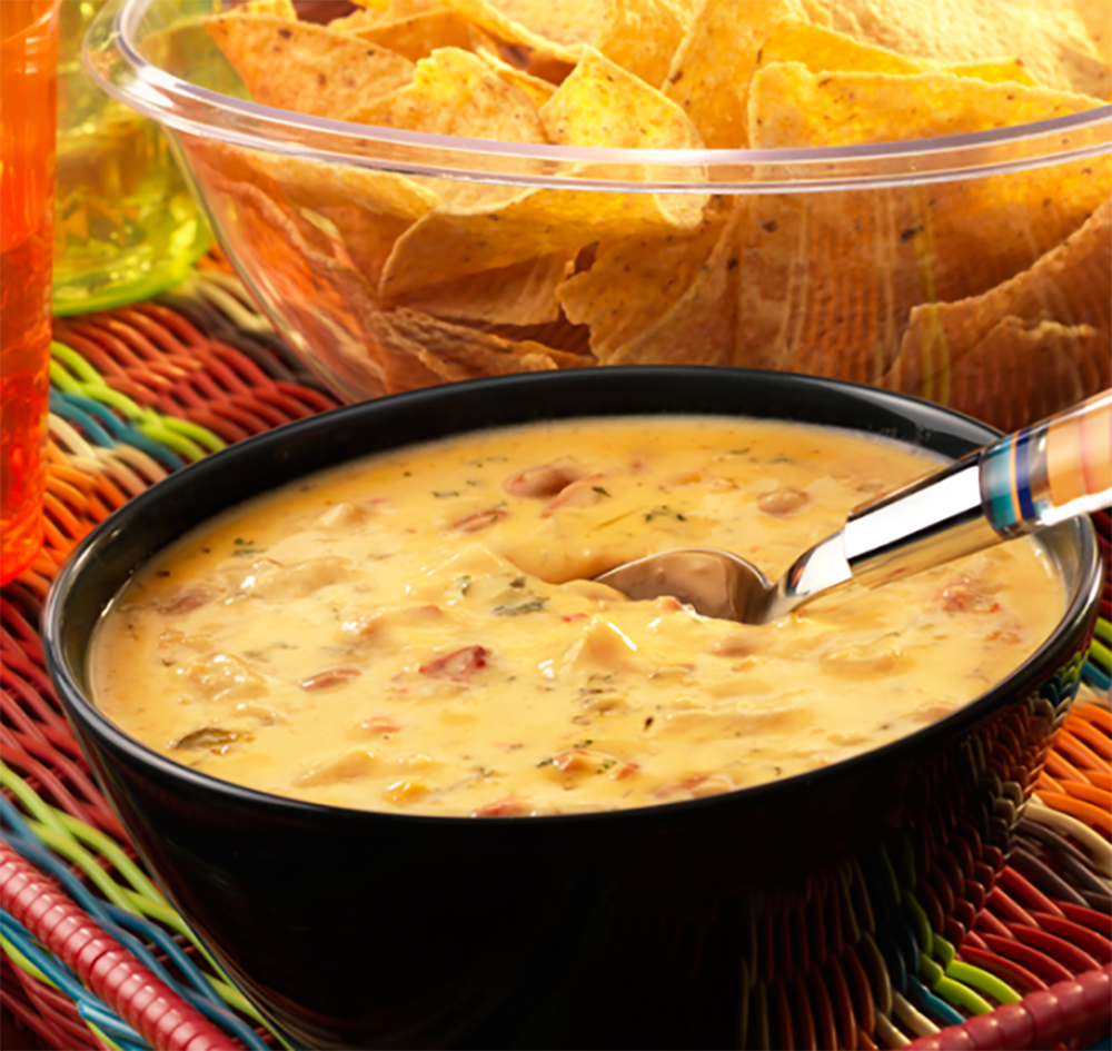 Looking for that perfect Queso Dip for your football watch party? Look no further. This recipe from Campbell's couldn't be easier. It's made with the company's Chunky Spicy Chicken Quesadilla Soup—2 ingredients and 3 minutes on the stove and you're ready to dip your way through the game!