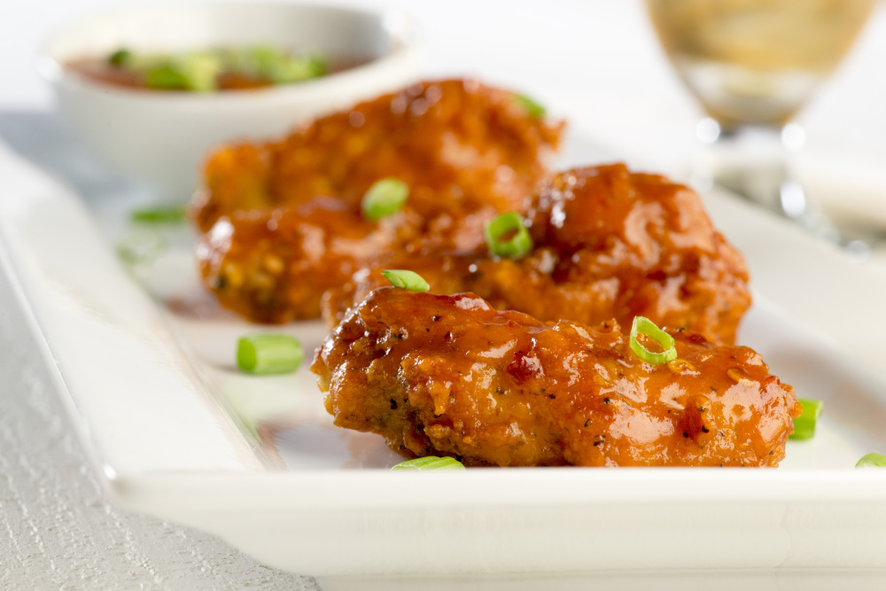 Crispy maple chipotle hot wings have all the heat you need for game-day entertaining. 