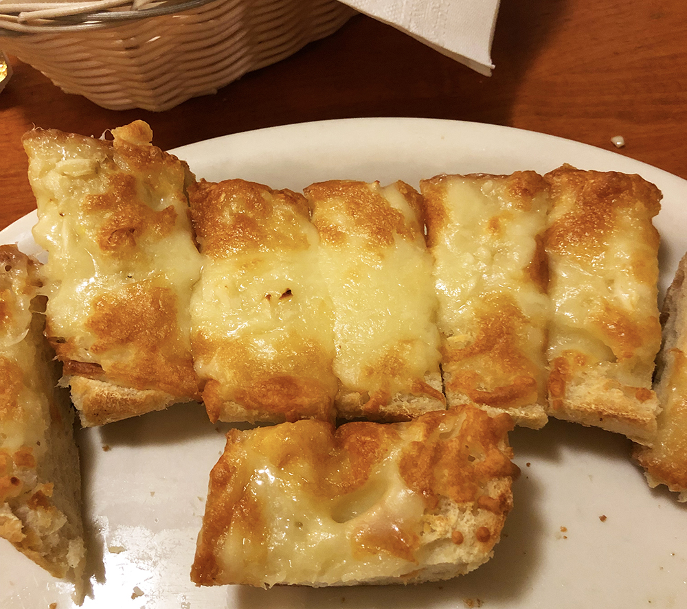 The garlic cheese bread at Bambino's cafe in Springfield, Missouri is toasted, loaded with fresh garlic and topped with melted cheese. 