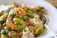 Hearty slow-simmered traditional gumbo served ladled over steamed white rice. Traditionally made with smoked ham, jumbo shrimp, okra, and just a hint of Cajun seasoning for that spicy kick.