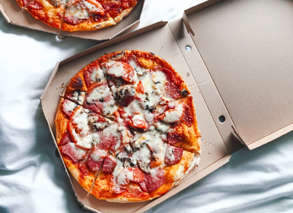 A box of takeout pizza is the reality for many couples on Valentine's Day. 
