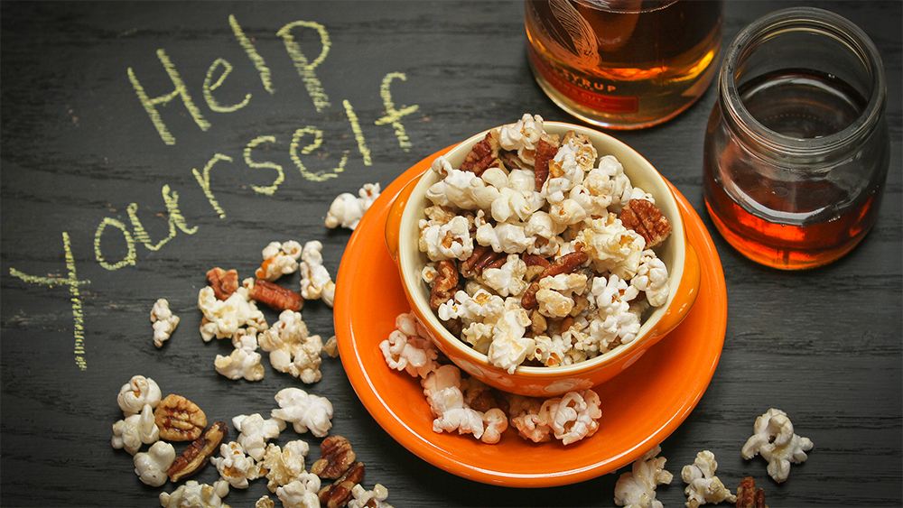 This maple glazed popcorn is perfect for watching the Super Bowl and is made with maple syrup from Runamok. 