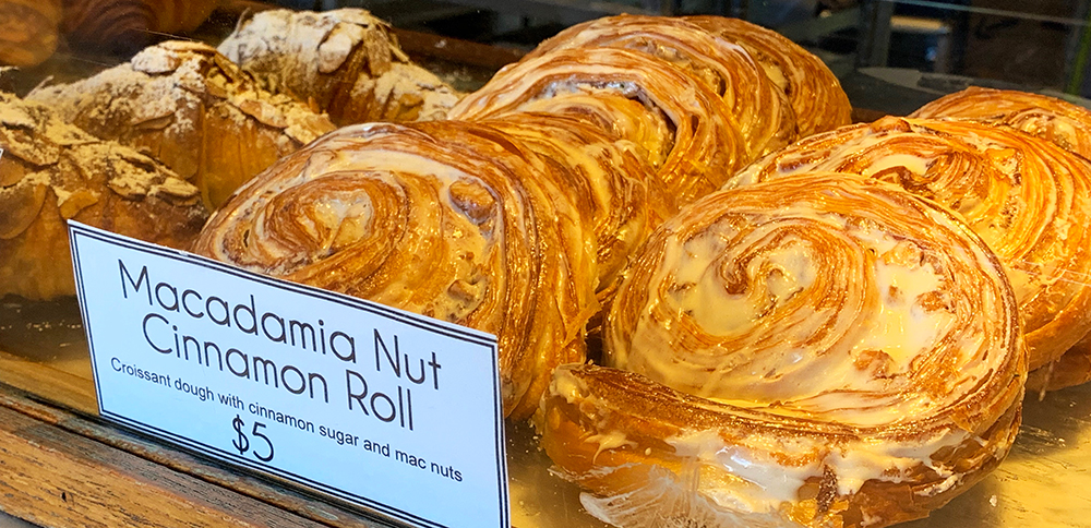 The chaser was a macadamia nut cinnamon roll, made with croissant dough so incredibly flaky that you got layers of flavor with each bite. The bakery setting lends itself to the enjoyment of the food, with the scent of freshly baked bread never far away.