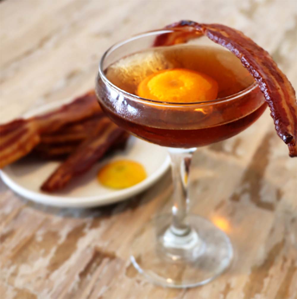 Maple Bacon Old Fashioned cocktail made with bourbon, maple syrup and bitters. 