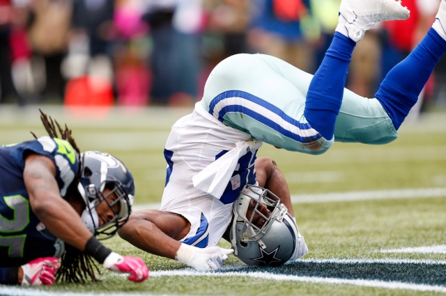 Dallas Cowboys running back DeMarco Murray (29) tumbles into the end zone after rushing for a touchdown against the Seattle Seahawks. (Joe Nicholson-USA TODAY Sports)