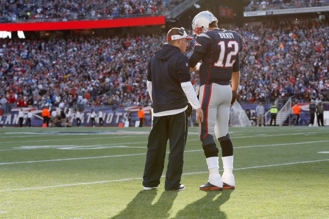 New England Patriots offensive coordinator Josh McDaniels (left) talks with quarterback Tom Brady (12) during the second quarter against the Detroit Lions. (Greg M. Cooper-USA TODAY Sports)