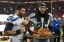 Seattle Seahawks quarterback Russell Wilson (3, left) and cornerback Richard Sherman (25) carry the turkey to the locker room after the game against the San Francisco 49ers. (Kyle Terada-USA TODAY Sports)