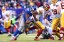 Washington Redskins quarterback Robert Griffin III (10) fumbles the ball as he's hit by New York Giants defensive tackle Johnathan Hankins. (Brad Penner-USA TODAY Sports)
