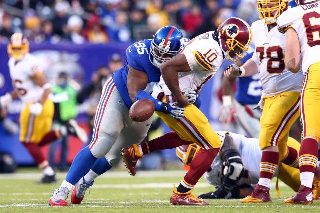 Washington Redskins quarterback Robert Griffin III (10) fumbles the ball as he's hit by New York Giants defensive tackle Johnathan Hankins. (Brad Penner-USA TODAY Sports)