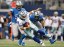 Dallas Cowboys quarterback Tony Romo (9) tries to escape the pressure by Detroit Lions defensive end Ezekiel Ansah (94) and Darryl Tapp (52). (Tim Heitman-USA TODAY Sports)
