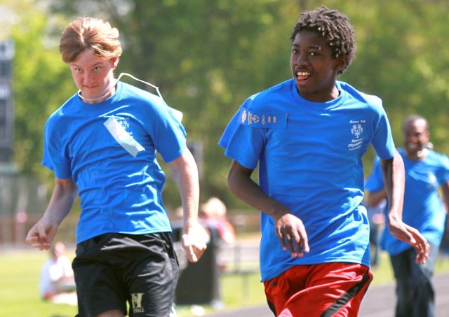 Cameron Boulware, left, and Junine Mattox of Anderson run in the 100 meter dash during the 37th annual Special Olympics Area 14 Spring Athletic Games at Westside High School. Cameron is the younger brother of Garrett and Ben Boulware of the Clemson baseball and football programs. (photo courtesy of the Anderson Independent, and taken by Ken Ruinard)