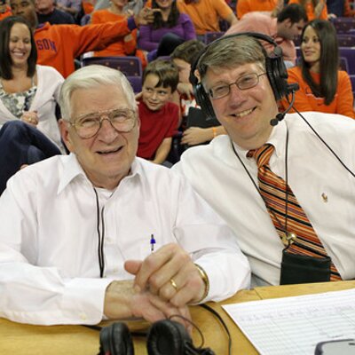 Clemson's longtime SID Tim Bourret, right, grew up listening to Notre Dame football on the radio with his father, left. (Photo from twitter, above photo USA Today).