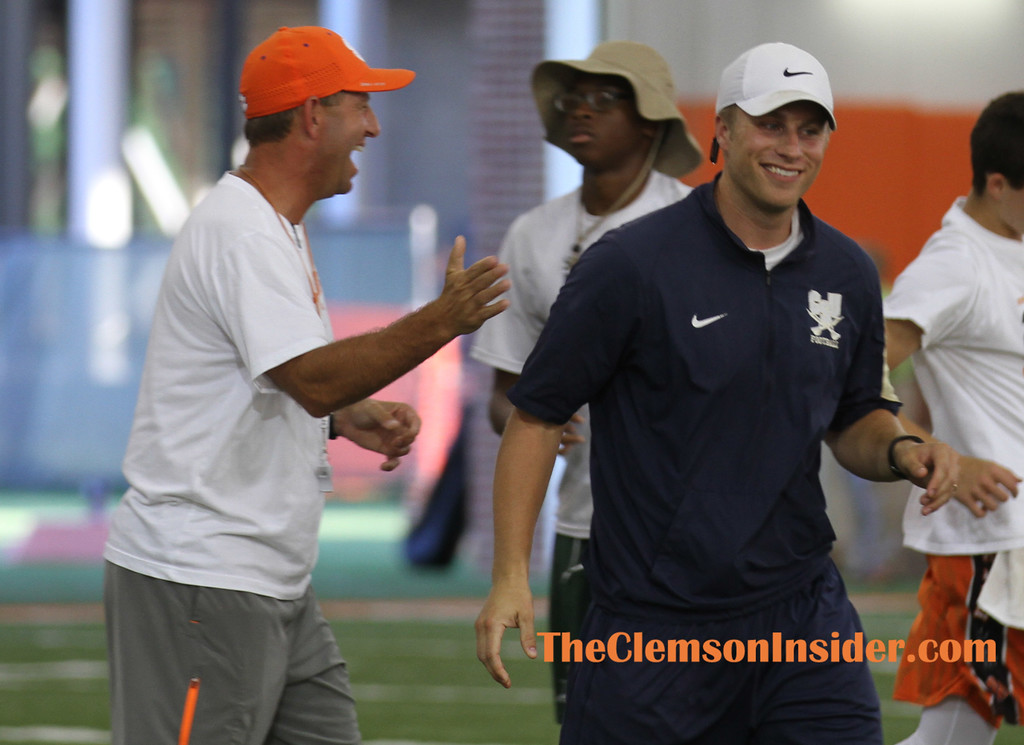 Clemson head coach Dabo Swinney (left) and former Tigers' quarterback Willy Korn share a laugh during a break on Tuesday at Dabo Swinney's High School Football Camp in Clemson.