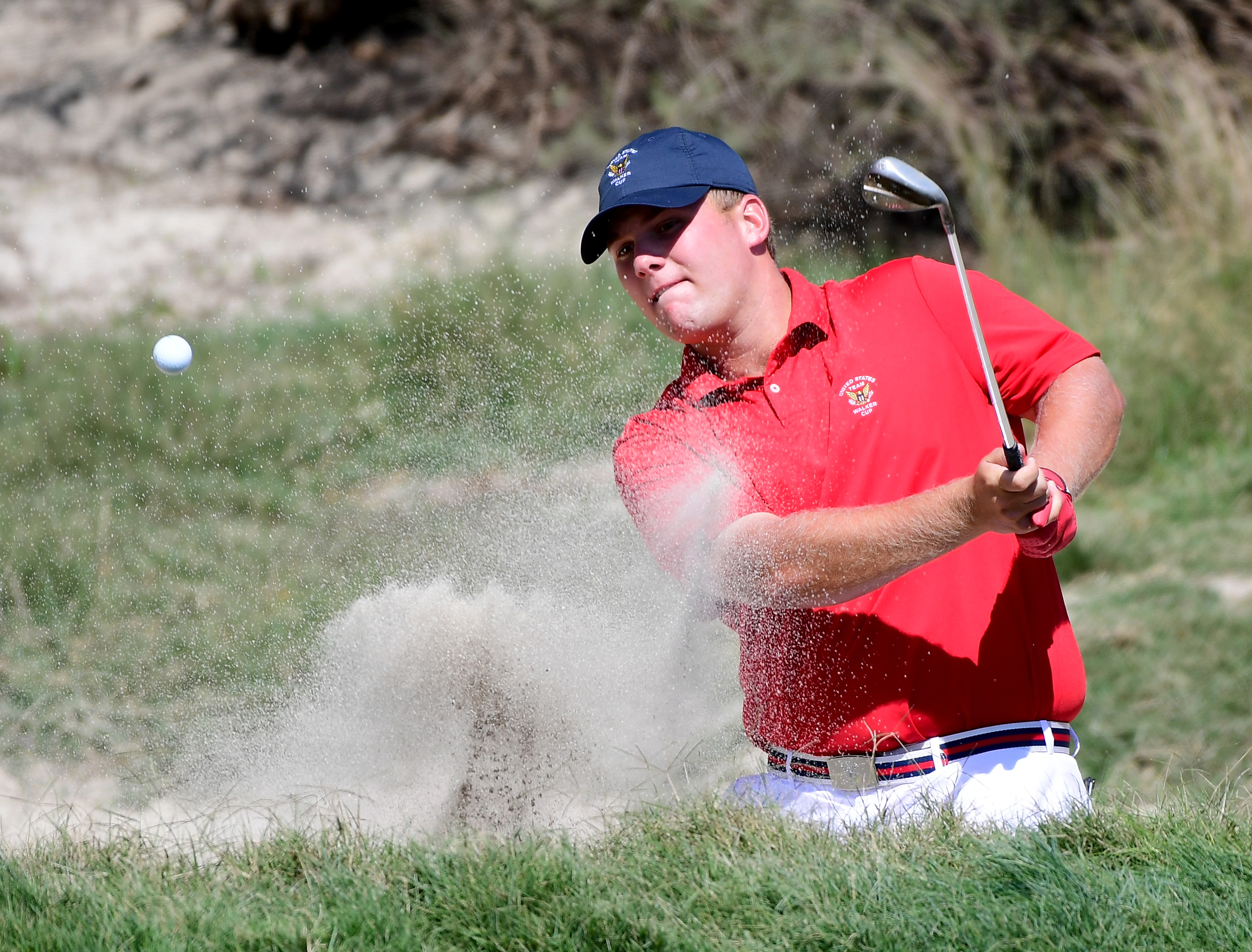 LOS ANGELES, CA - SEPTEMBER 09: Braden Thornberry of Team USA his out of a bunker on the eighth hole in a two up win over Harry Ellis of Team Great Britain and Ireland during the singles matches in the 2017 Walker Cup at the Los Angeles Country Club on September 9, 2017 in Los Angeles, California. (Photo by Harry How/Getty Images)