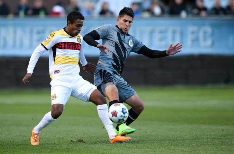 Kevin Venegas, right, in action for Minnesota.