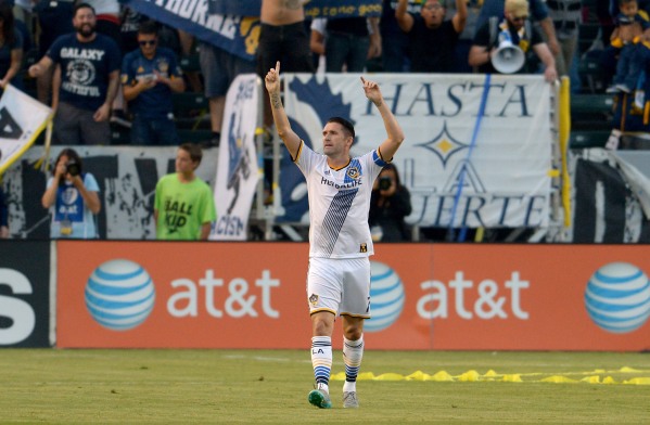 Jul 4, 2015; Carson, CA, USA; Los Angeles Galaxy forward Robbie Keane (7) heads down field after scoring past Toronto FC goalkeeper Chris Konopka (1) in the first half of the game at StubHub Center. Mandatory Credit: Jayne Kamin-Oncea-USA TODAY Sports