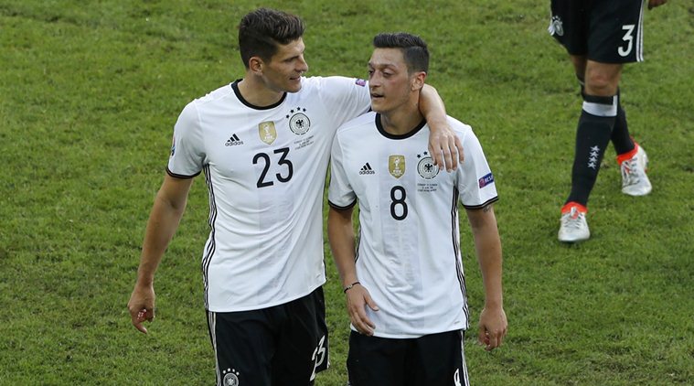 Football Soccer - Germany v Slovakia - EURO 2016 - Round of 16 - Stade Pierre Mauroy - Lille, France - 26/6/16 Germany's Mario Gomez and Mesut Ozil after the match   REUTERS/Benoit Tessier