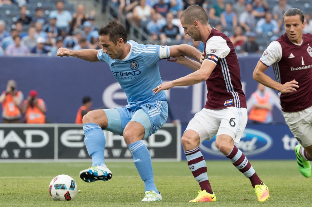 Jul 30, 2016; New York, NY, USA; New York City FC midfielder Frank Lampard (8) controls the ball while defended by Colorado Rapids midfielder Sam Cronin (6) during the first half at Yankee Stadium. Mandatory Credit: Vincent Carchietta-USA TODAY Sports