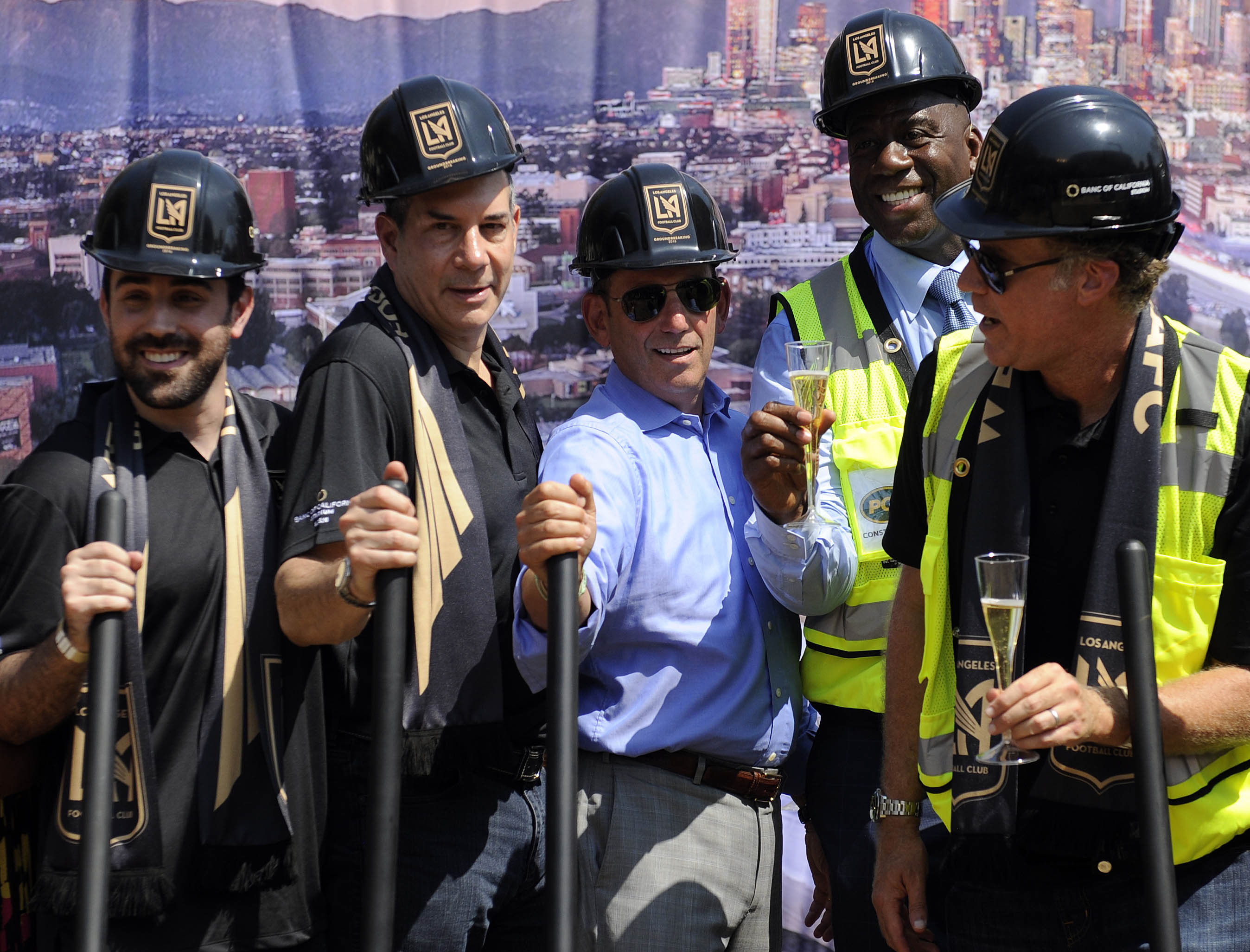 August 23, 2016; Los Angeles, CA, USA; MLS commissioner Don Garber poses for a photograph with LAFC part owners Brandon Beck, Lon Rosen, Magic Johnson and Will Ferrell at Los Angeles Football Club Stadium Site. The venue will be named Banc Of California Stadium. Mandatory Credit: Gary A. Vasquez-USA TODAY Sports