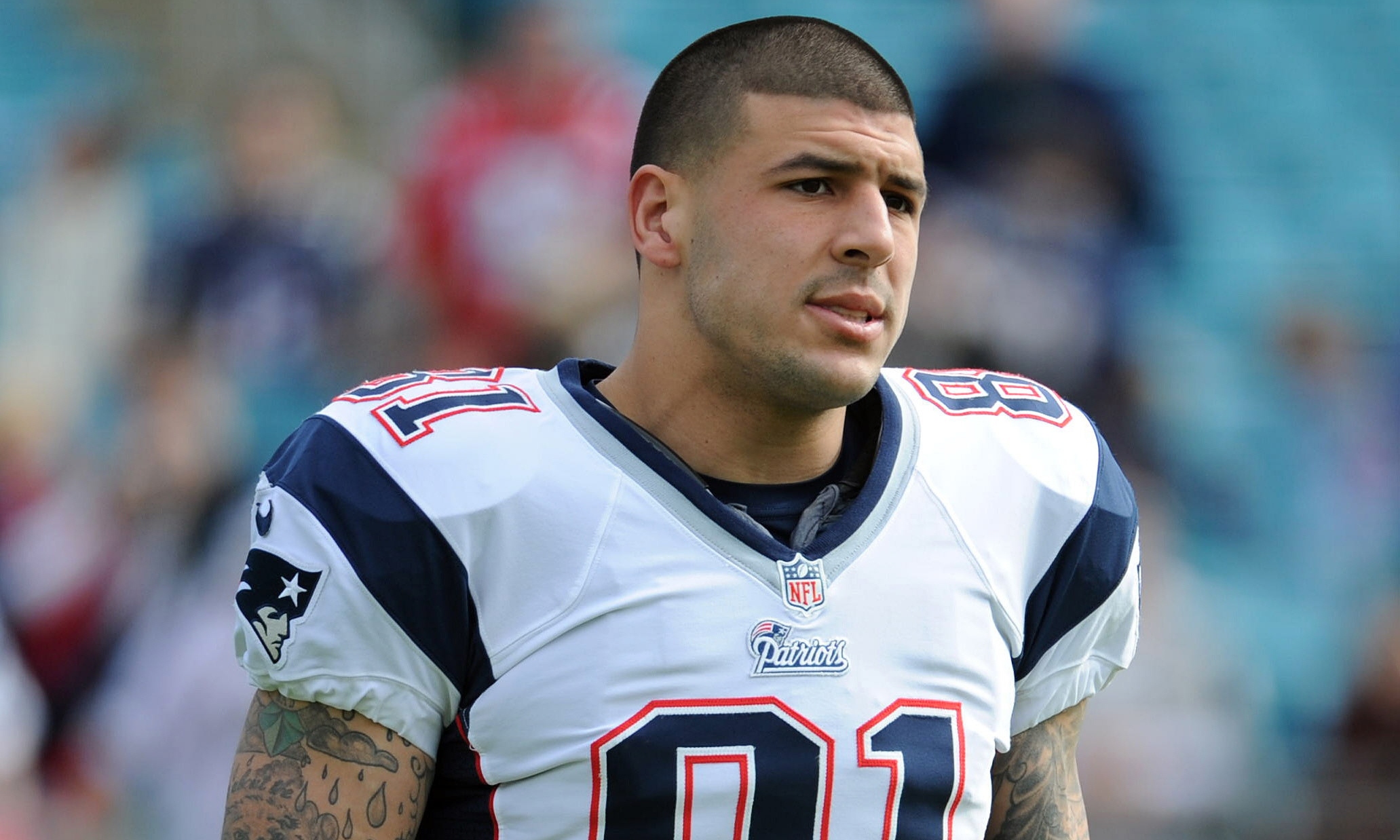 29 August 2012 - East Rutherford, New Jersey - New England Patriots tight  end Aaron Hernandez (81) looks on with his helmet in hand during warm-ups  prior to the NFL preseason game