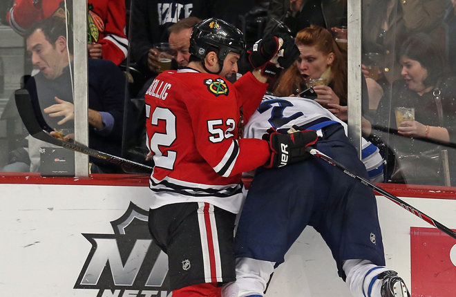 Fan steals, wears player’s helmet after he’s checked through the glass ...