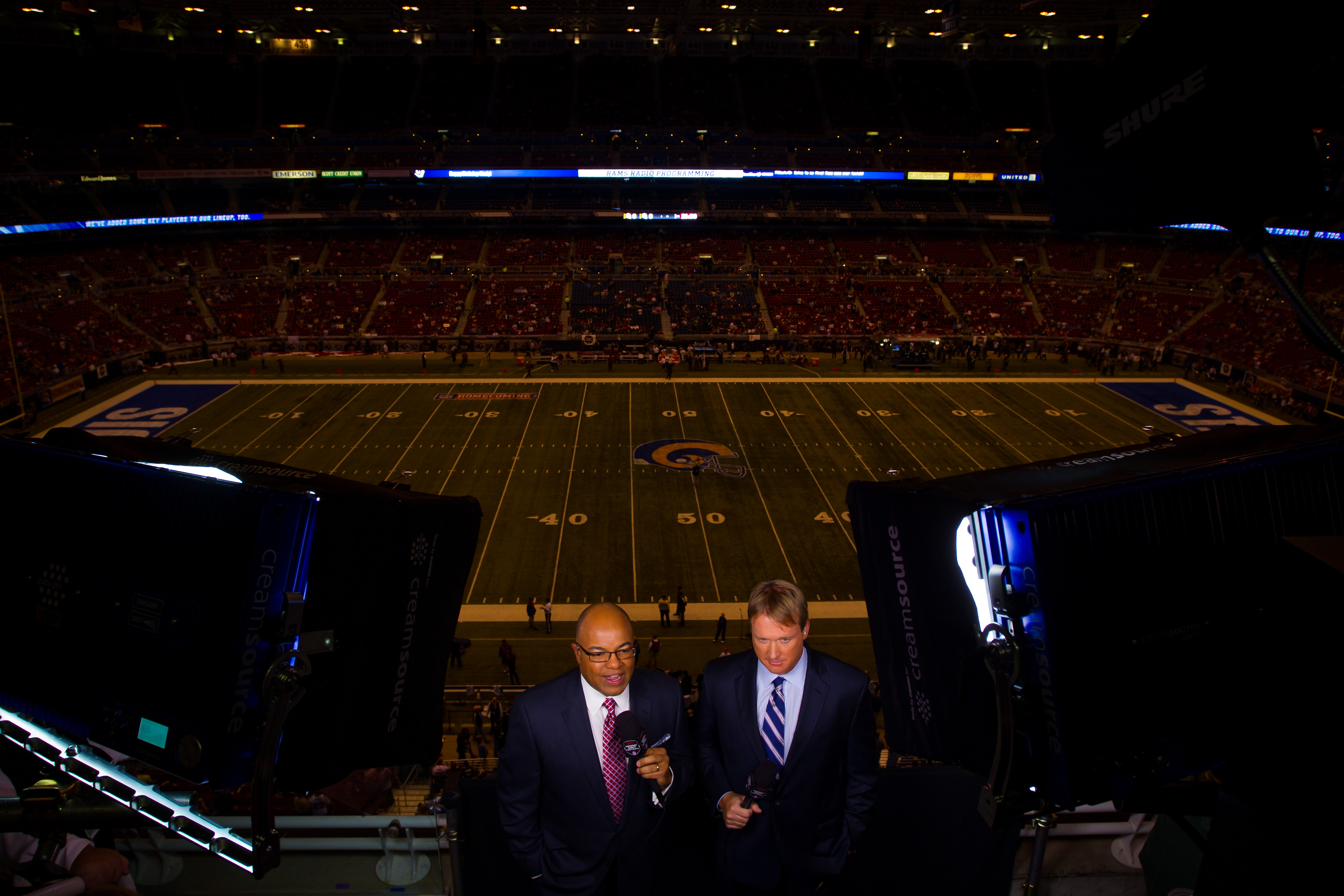 ESPN play-by-play announcer Mike Tirico (left) and analyst Jon Gruden kick off the Monday Night Football broadcast between the St. Louis Rams and the San Francisco 49ers at the Edward Jones Dome in downtown St. Louis. (Photo by Guy Rhodes-USA TODAY  Sports)