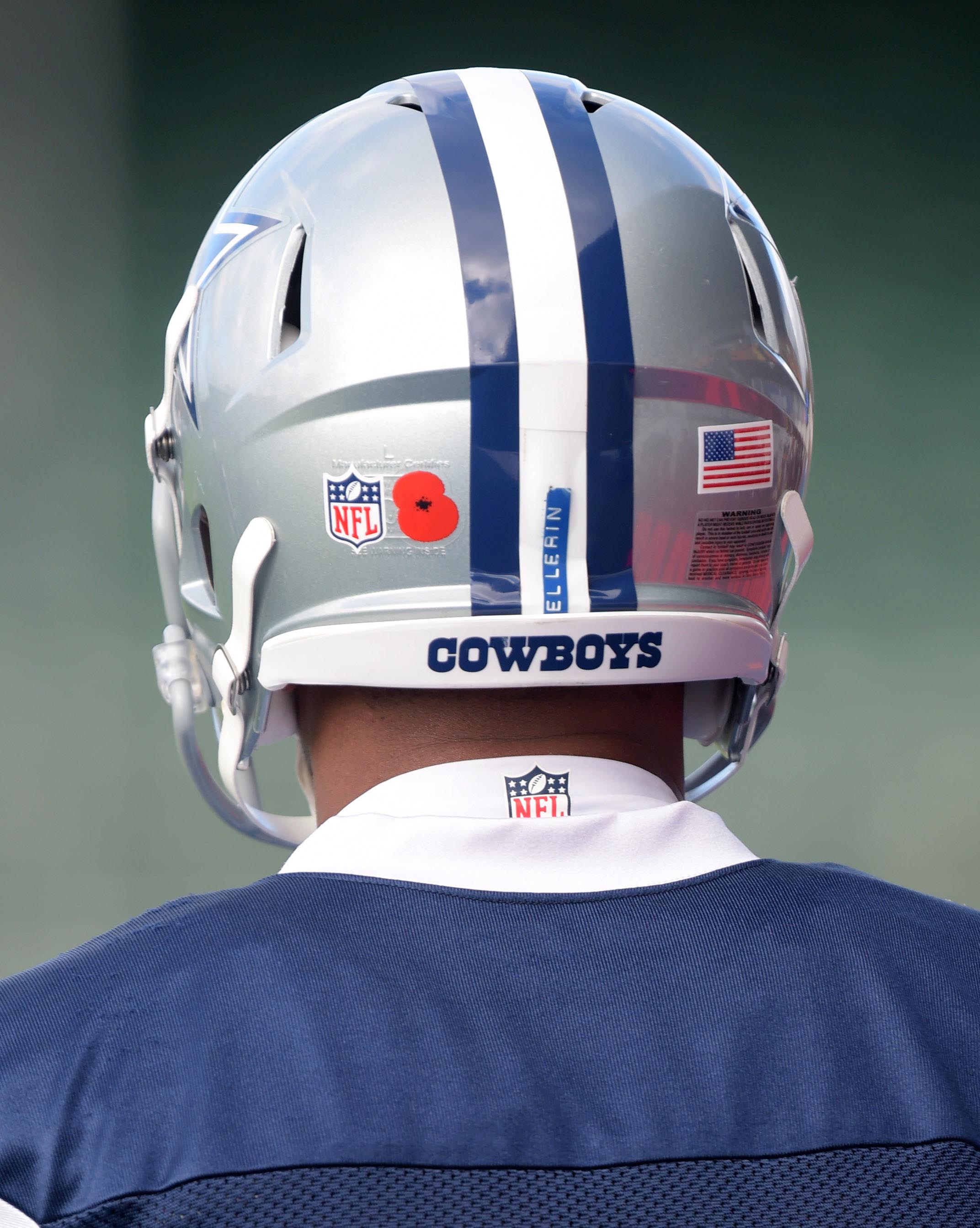 Why are the Dallas Cowboys wearing red flowers on their London jerseys?