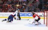 Alex Ovechkin scores past Cory Schneider while airborne. (Ed Mulholland, USA TODAY Sports)