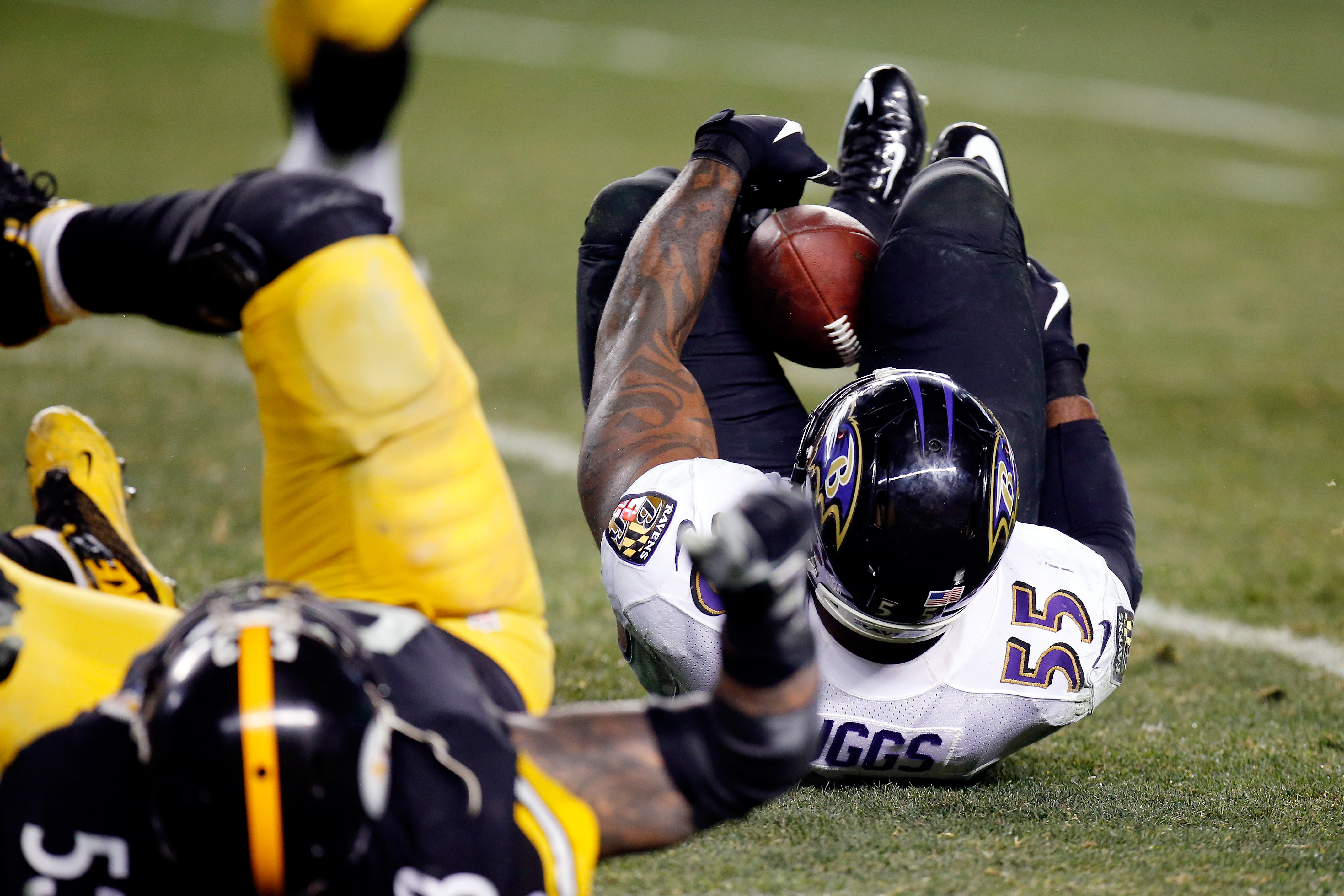 Baltimore Ravens OLB Terrell Suggs (55) celebrates after making an  interception during the first quarter a preseason matchup against the  Washington Redskins at M&T Bank Stadium in Baltimore, MD on August 29